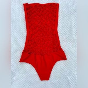 Like new MIKOH strapless one piece suit. Orange. Size medium. Crochet back.